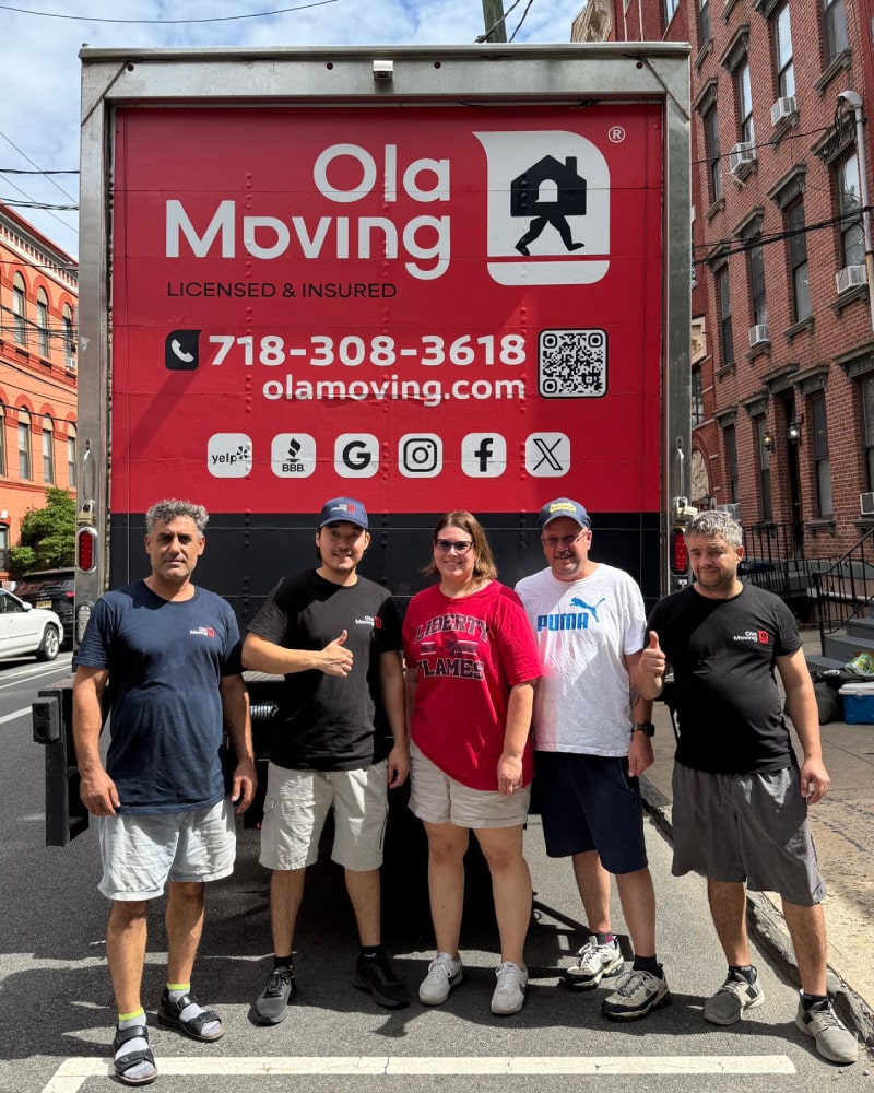 Ola Moving crew with happy clients